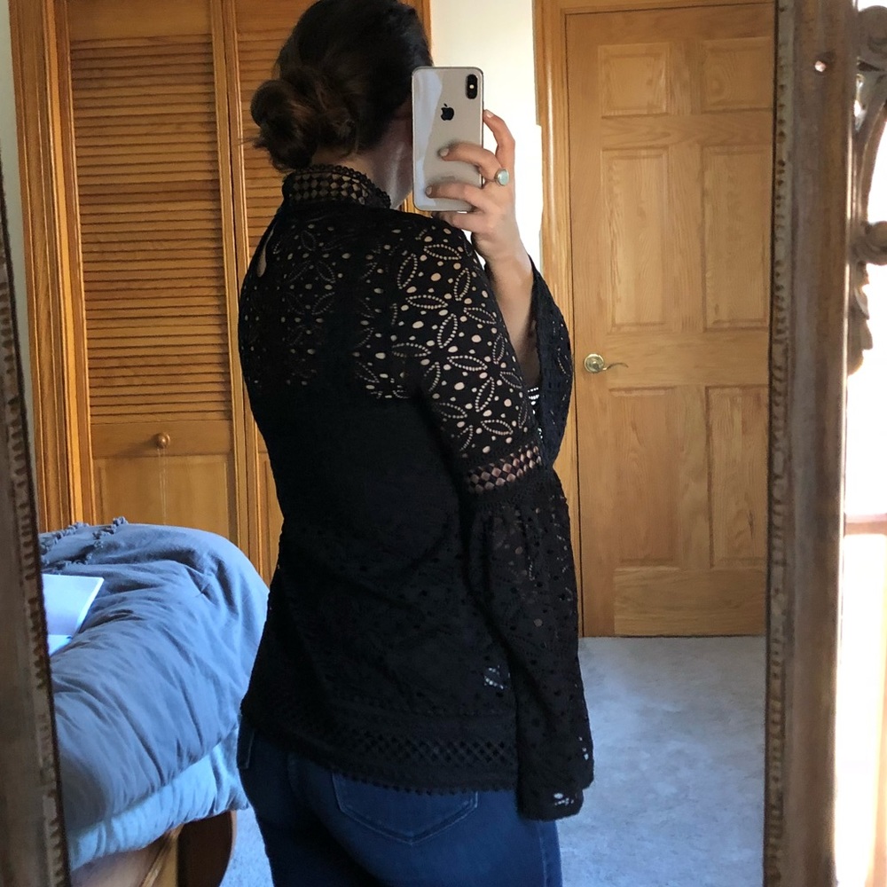 Black eyelet bell sleeve top